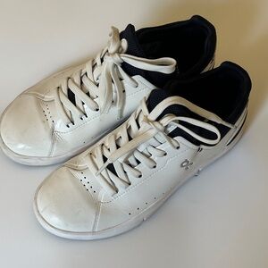 On Running White and Black Athletic Shoes